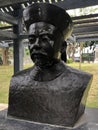 A black bronze statue with a hat ÃÂ 